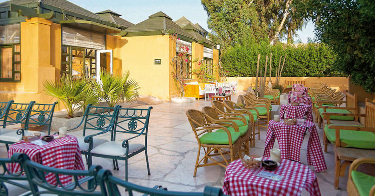 Een foto van het terras bij The Three Corners Rihana Inn