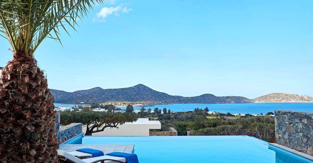 Een foto van het zwembad bij Elounda Palm Hotel & Suites