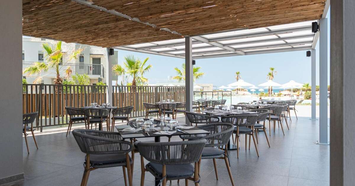 Een foto van het terras bij Portes Lithos Luxury Resort