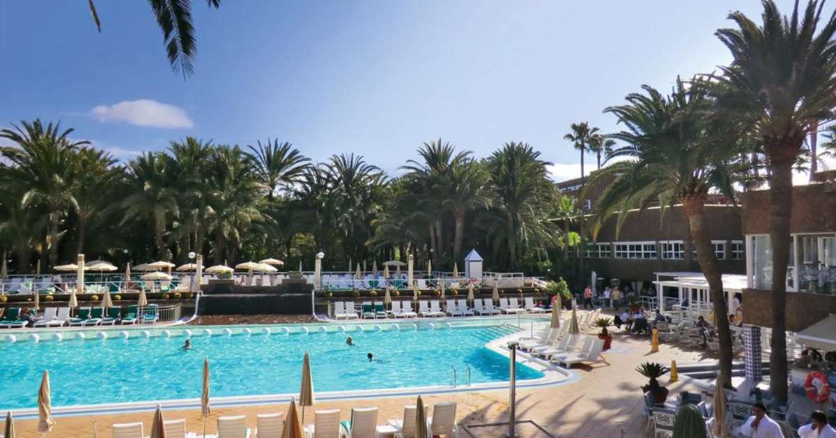 Een foto van het zwembad bij Riu Palace Oasis
