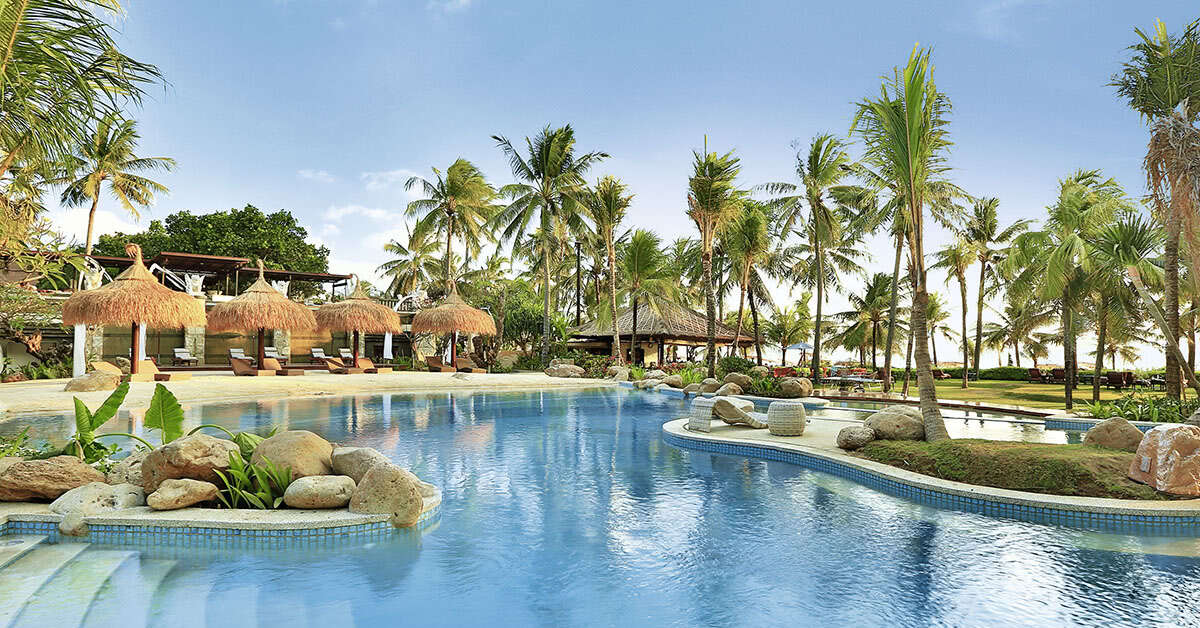 Een foto van het zwembad bij Bali Mandira Beach Resort & Spa