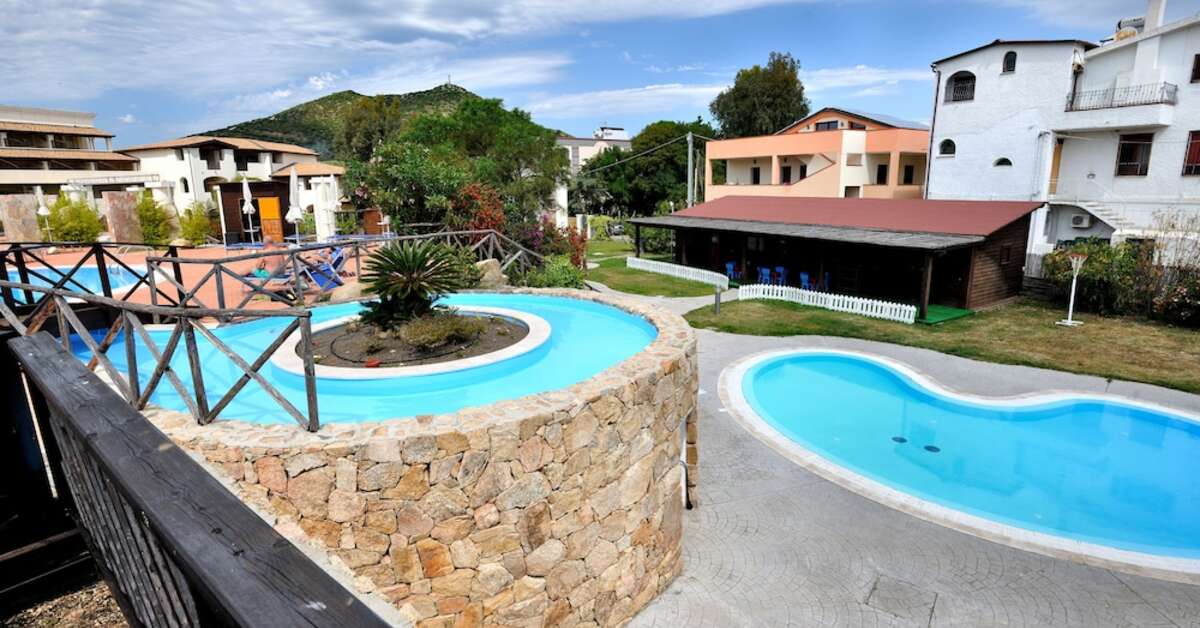 Een foto van het zwembad bij Cala della Torre Club Hotel