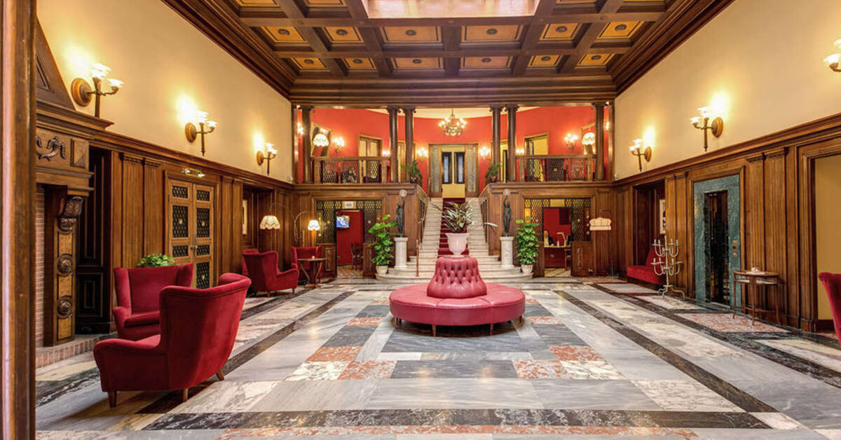 Een foto van het interieur van Grand Hotel Villa Politi