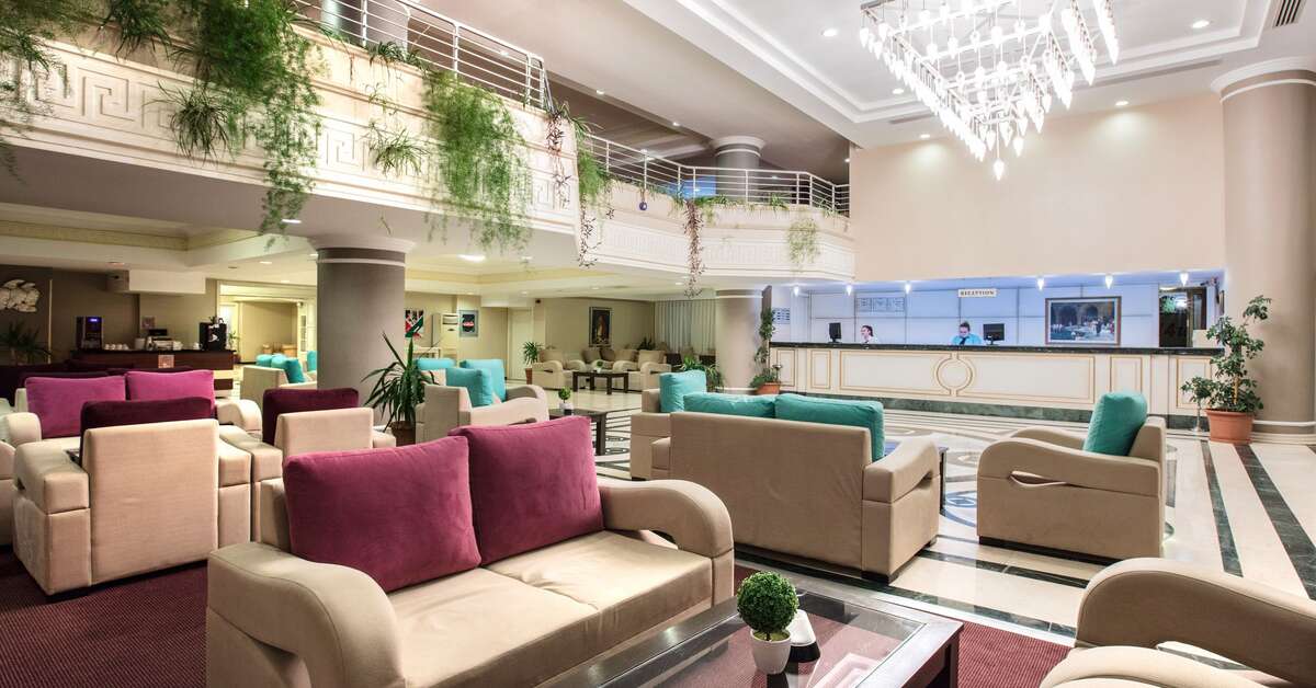 Een foto van het interieur van Palmin Hotel