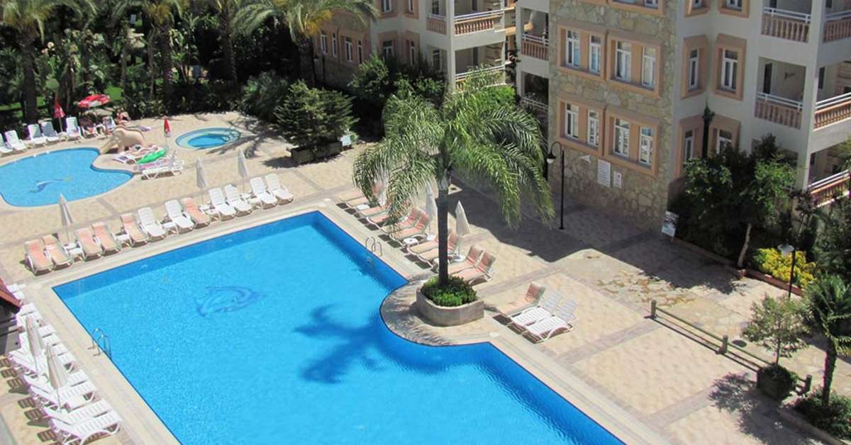 Een foto van het zwembad bij Side Village Family Suite Hotel