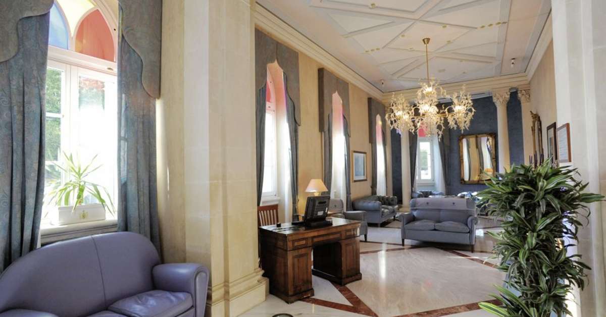 Een foto van het interieur van Grand Hotel Ortigia