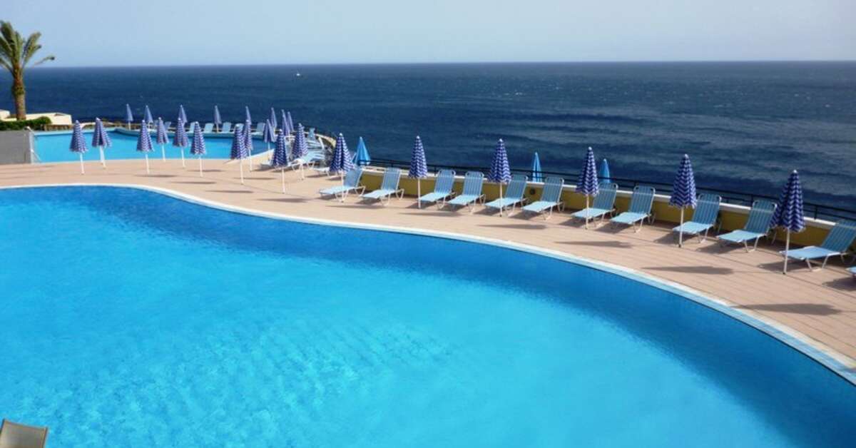 Een foto van het zwembad bij Athina Palace Resort & Spa