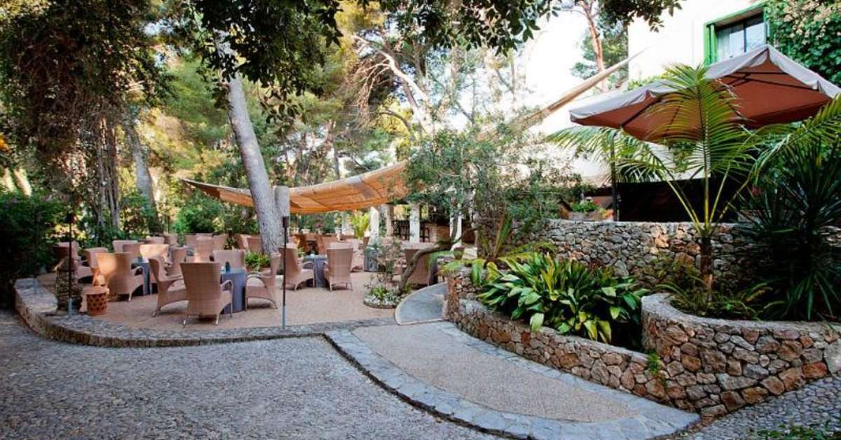 Een foto van het terras bij Hotel Lago Garden Suites & Spa