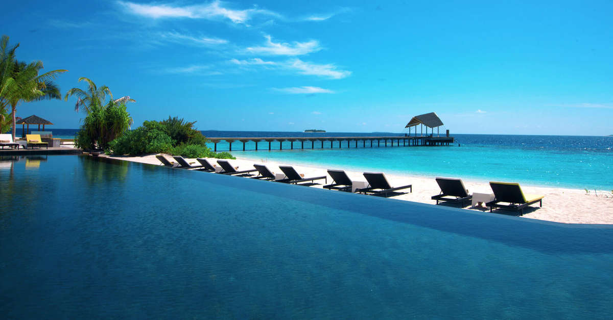 Een foto van het strand bij NH Collection Maldives Havodda Resort