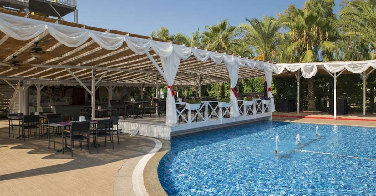 Een foto van het zwembad bij Delphin Palace Hotel