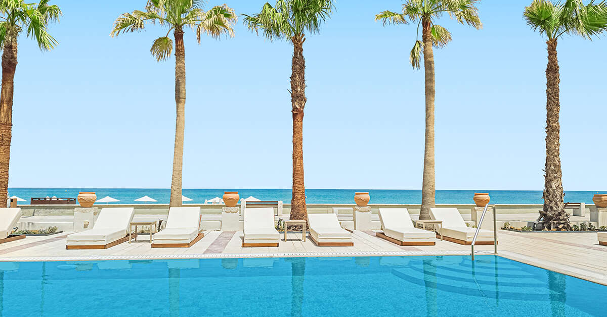 Ein Foto vom Pool im Grecotel Plaza Beach House