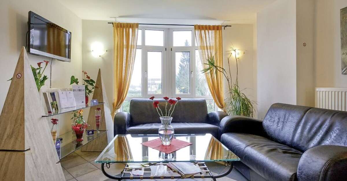 Een foto van het interieur van Azimut Hotel Erding