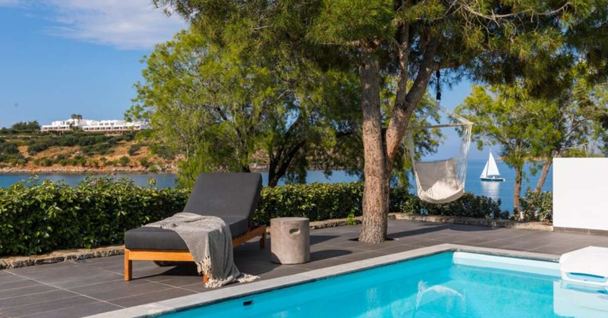 Een foto van het zwembad bij Minos Beach Art Hotel