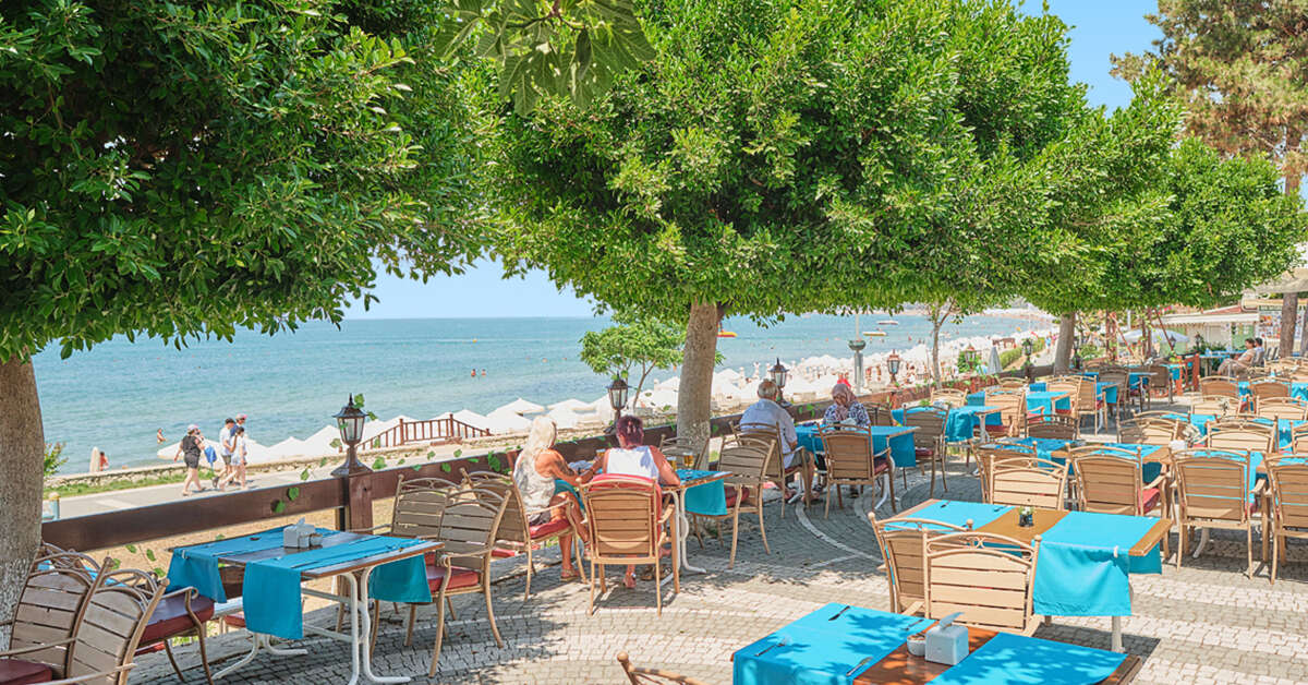 Een foto van het terras bij Clover Magic Nova Beach Hotel