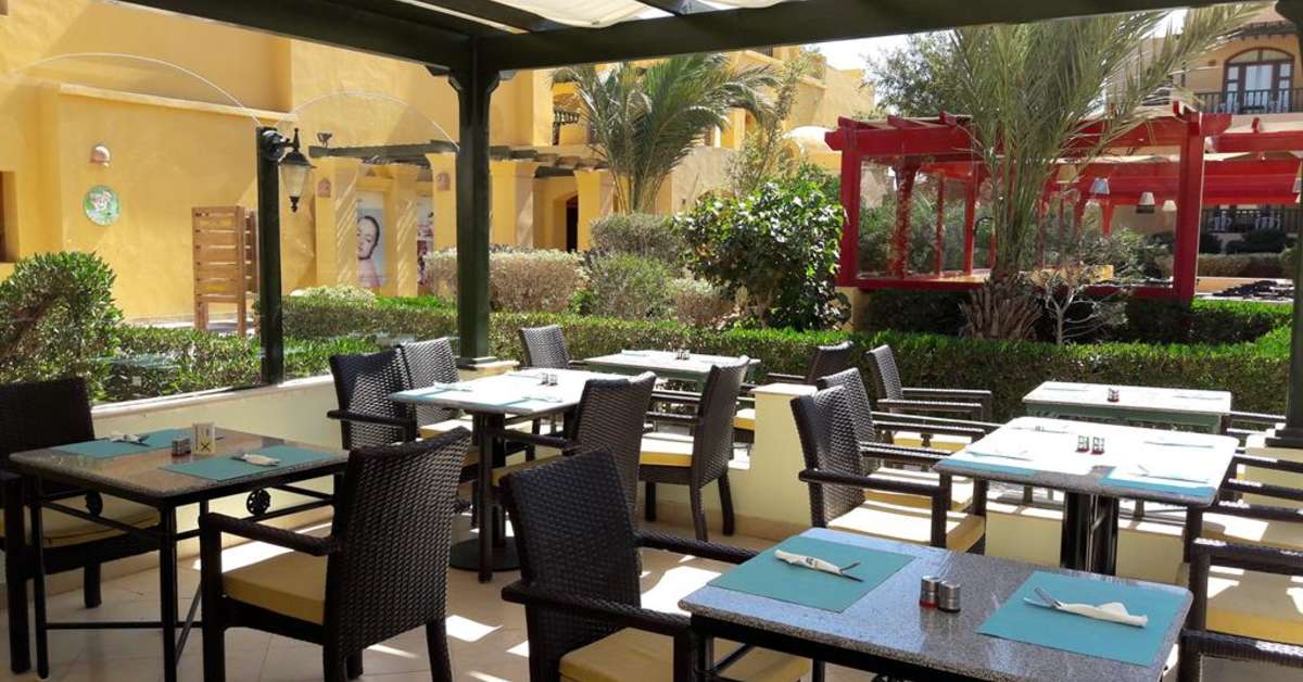 Een foto van het terras bij The Three Corners Rihana Inn
