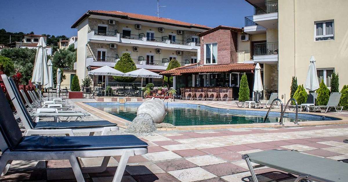 Een foto van het zwembad bij Ilios Hotel