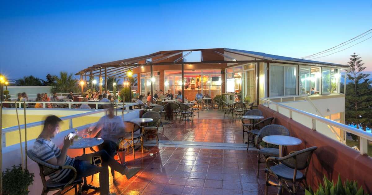 Een foto van het terras bij Corali Hotel & Village