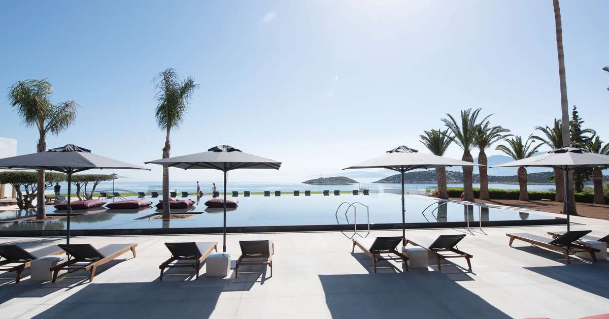 Een foto van het zwembad bij Minos Palace Hotel & Suites