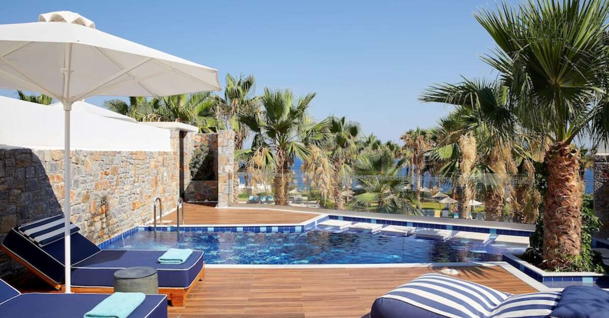 Een foto van het zwembad bij Minos Imperial Luxury Beach Resort & Spa
