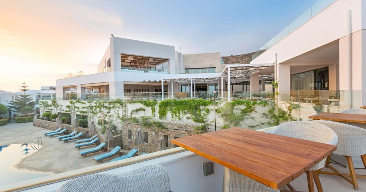 Een foto van het terras bij The Royal Blue Resort & Spa