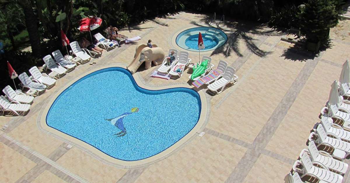 Een foto van het zwembad bij Side Village Family Suite Hotel