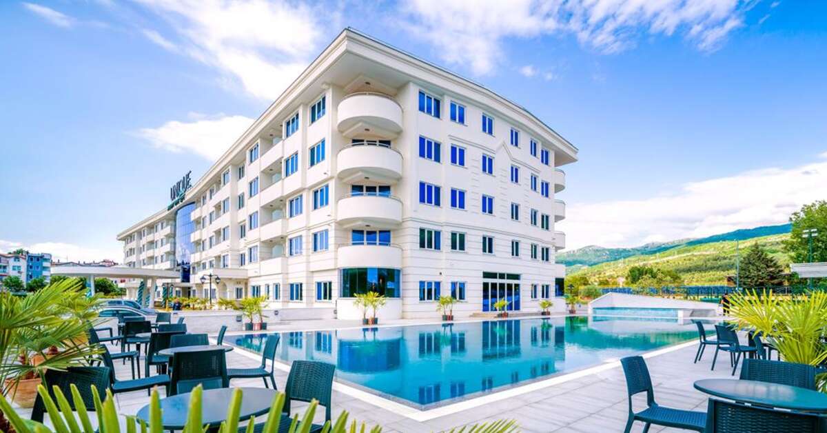 Een foto van het zwembad bij Unique Resort & Spa