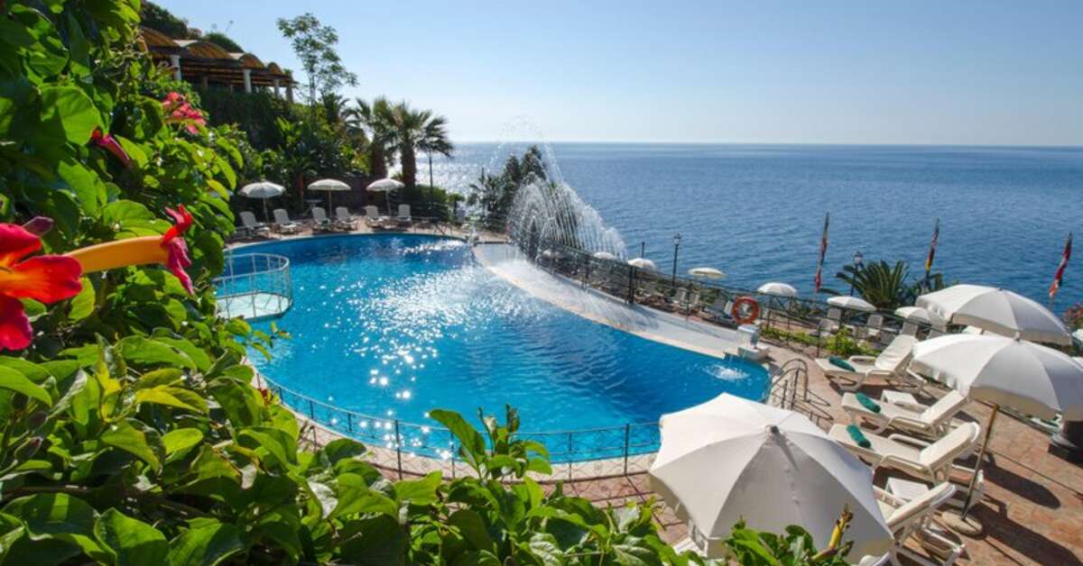 Een foto van het zwembad bij Baia Taormina Hotel
