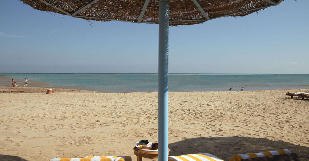 Ein Foto vom Strand beim Sunrise Alora Aqua Park Resort