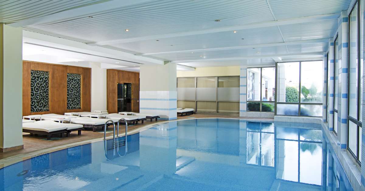 Een foto van het zwembad bij Palmin Hotel