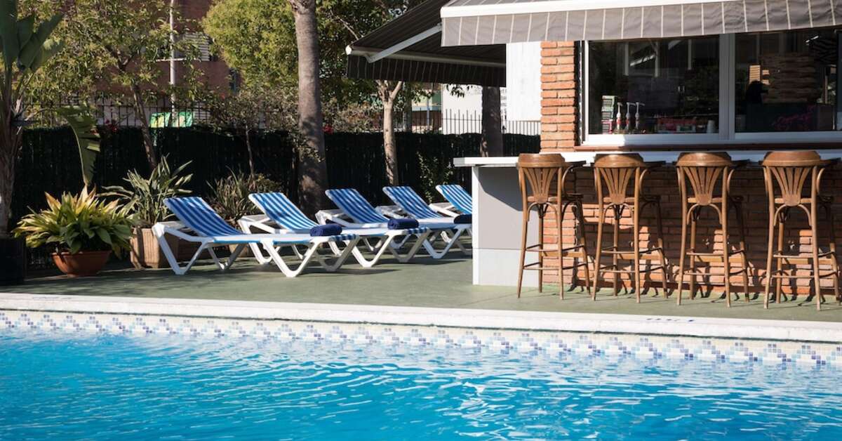 Een foto van het zwembad bij H-Top Hotel Palm Beach