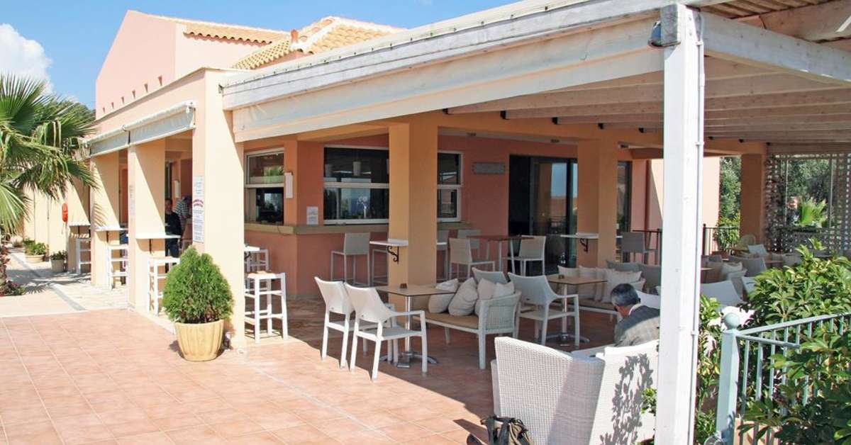 Een foto van het terras bij Astra Village Hotel & Spa