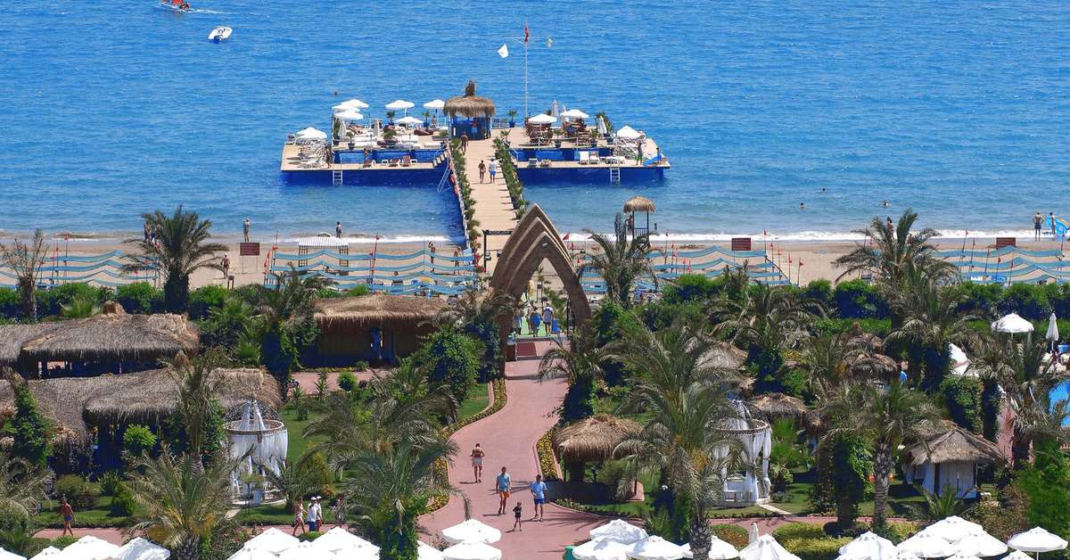 Een foto van het strand bij Delphin Palace Hotel