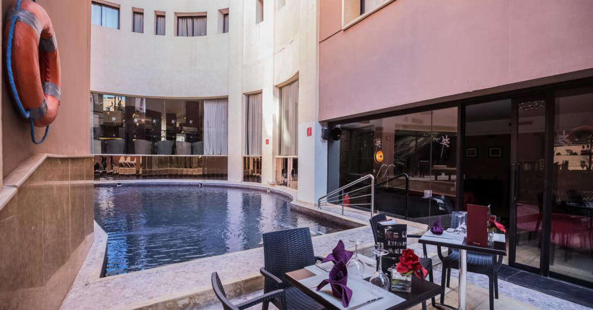 Een foto van het zwembad bij Dellarosa Boutique Hotel & Spa