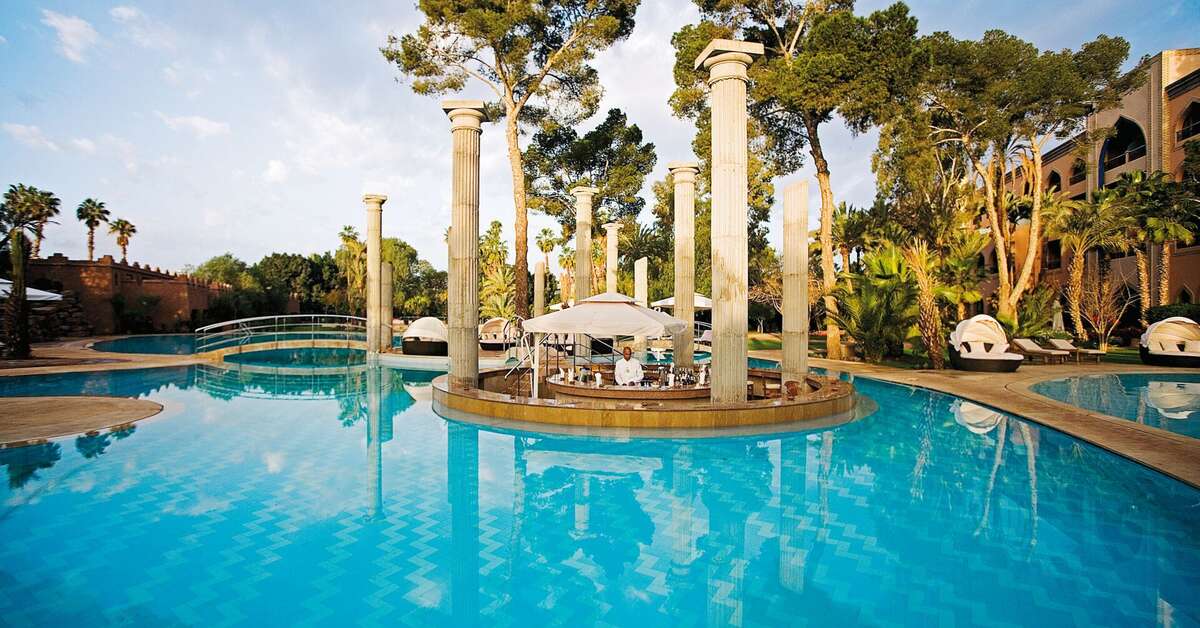 Ein Foto vom Pool im Es Saadi Marrakech Resort Hotel