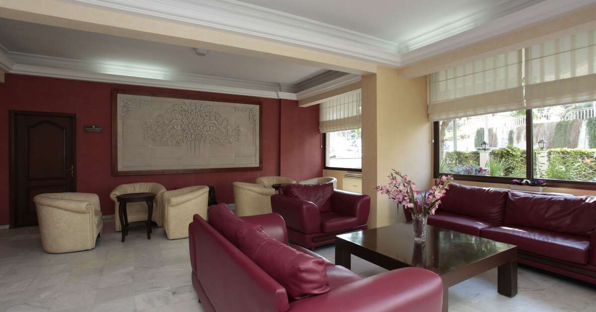 Een foto van het interieur van Palm Hotel