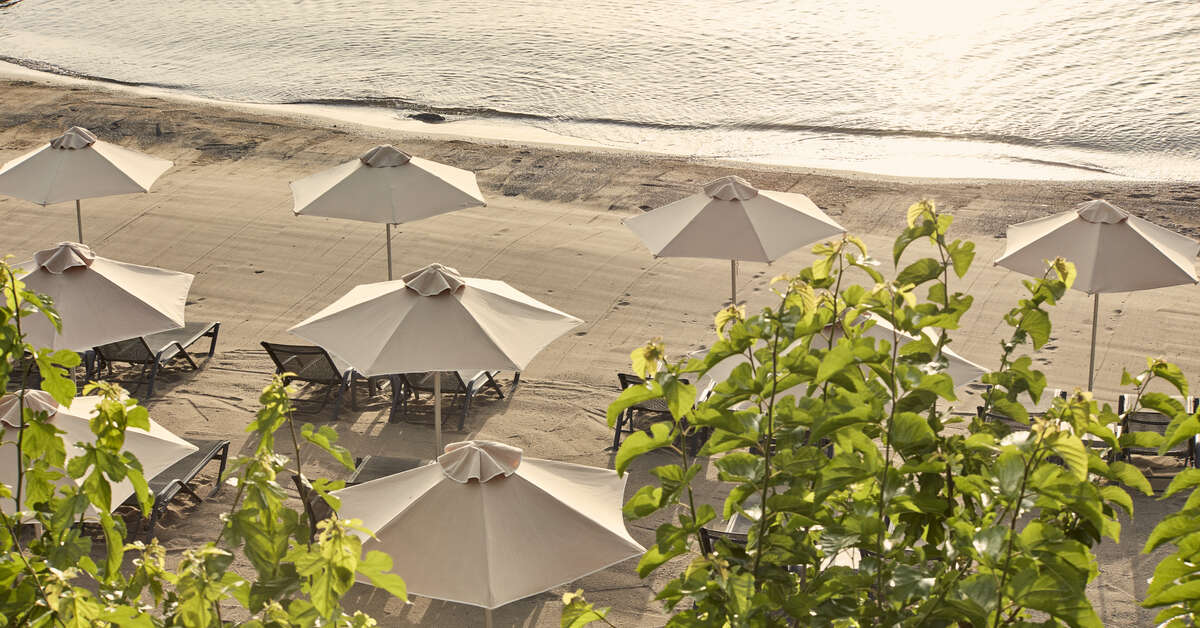 Een foto van het strand bij Minos Palace Hotel & Suites