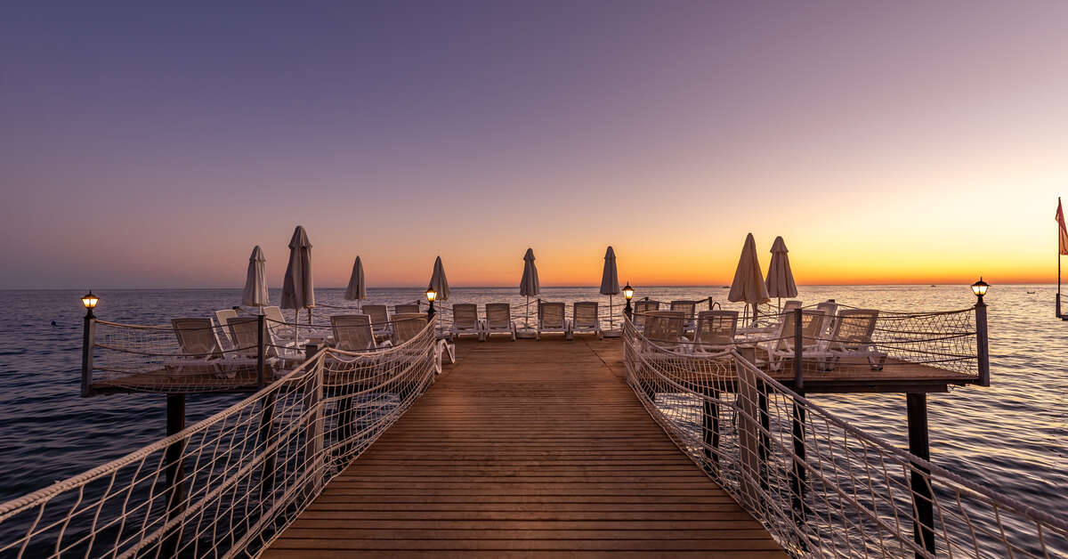 Een foto van het strand bij White City Beach Hotel