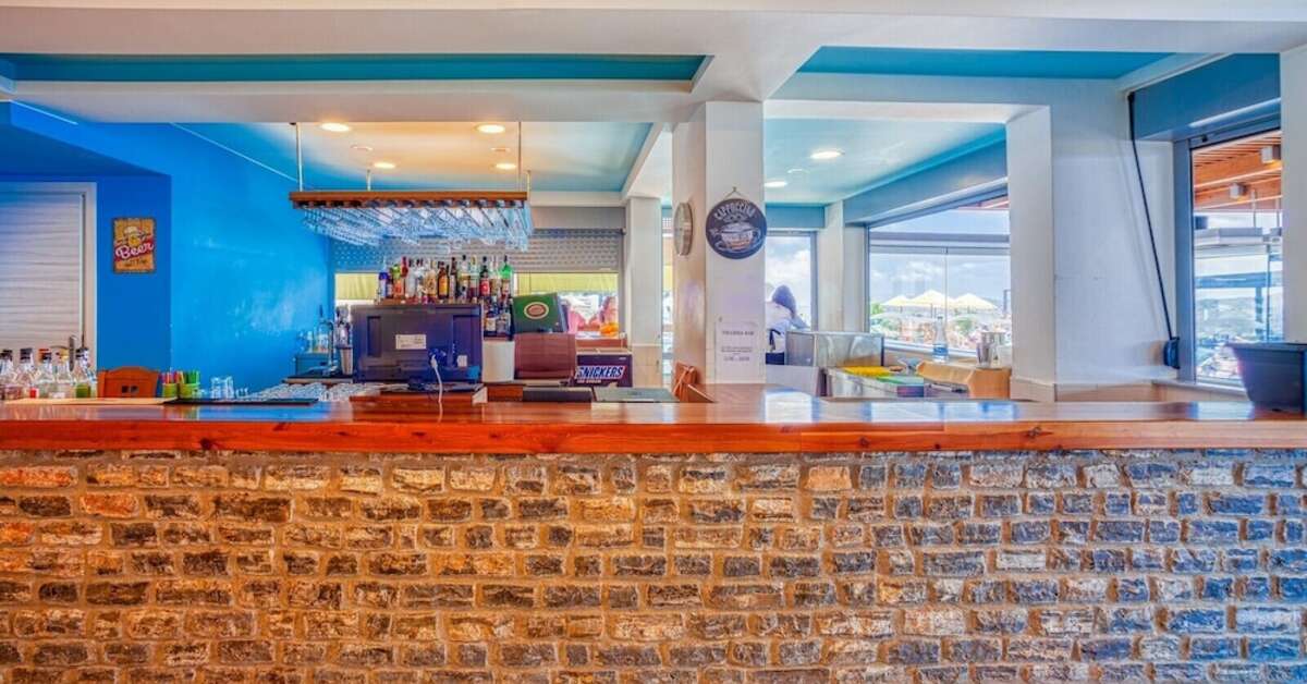 Een foto van het interieur van Elounda Water Park Residence Hotel