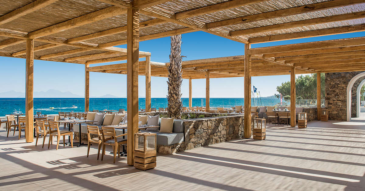 Een foto van het terras bij Mitsis Norida Beach Hotel