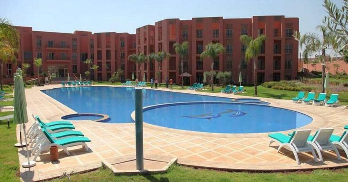 Een foto van het zwembad bij Palm Appart Club