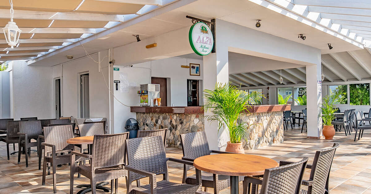 Een foto van het terras bij Evripides Village Beach Hotel