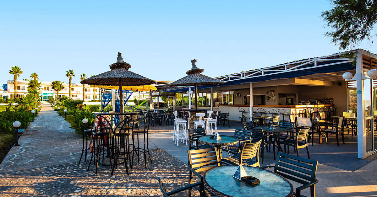 Een foto van het terras bij Costa Angela Seaside Resort