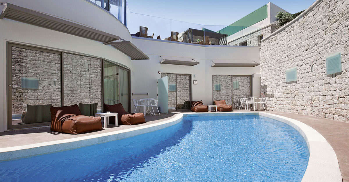 Een foto van het zwembad bij Aloe Boutique & Suites