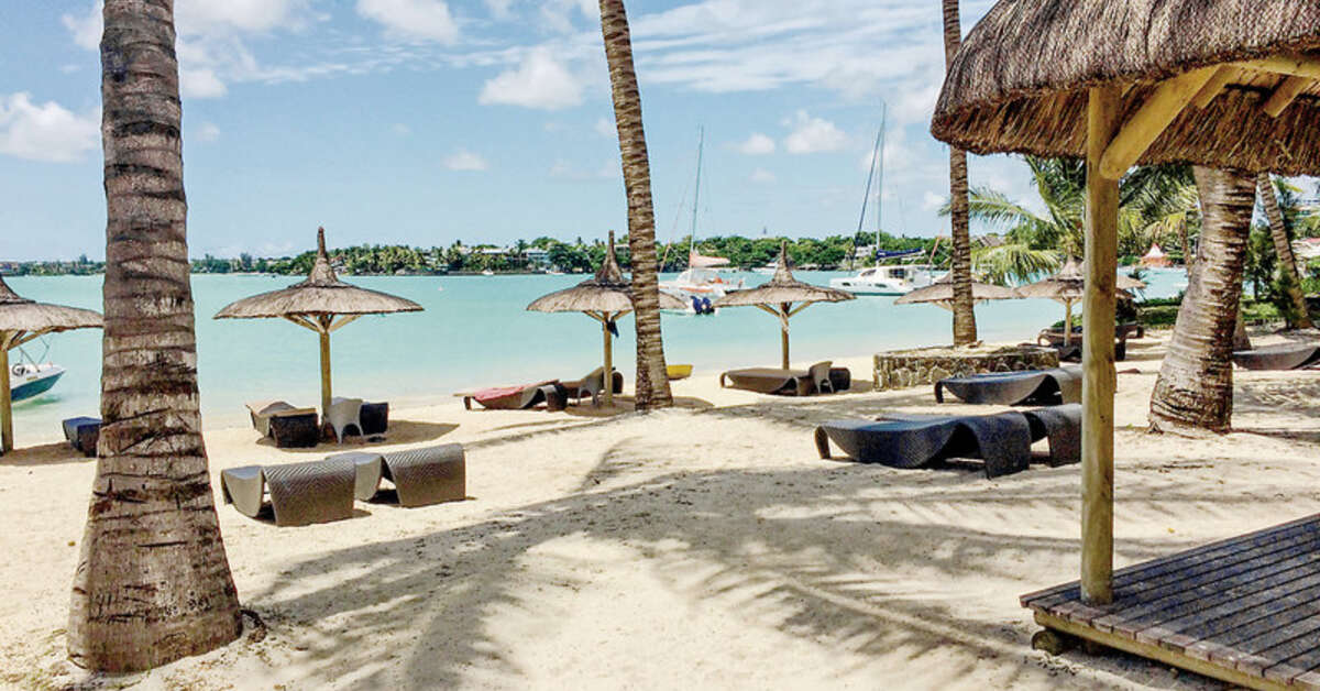Ein Foto vom Strand beim Ocean Beach & Villas