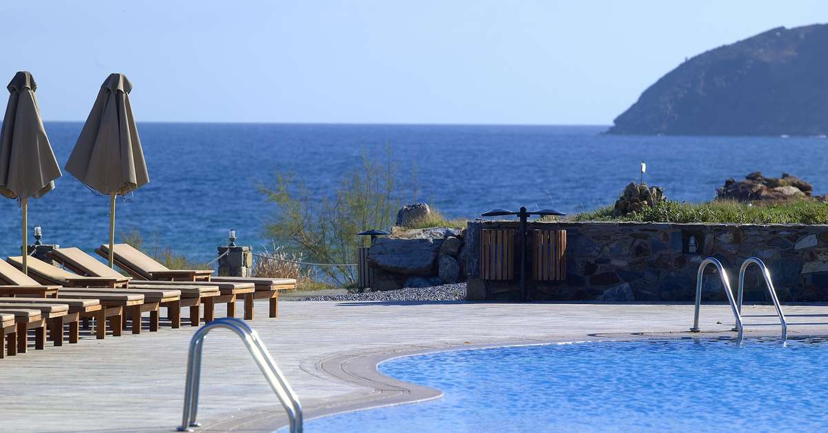 Een foto van het zwembad bij The Royal Blue Resort & Spa