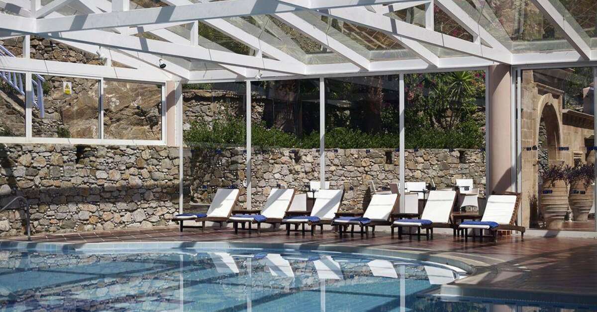 Een foto van het zwembad bij Mitsis Rodos Village Beach Hotel