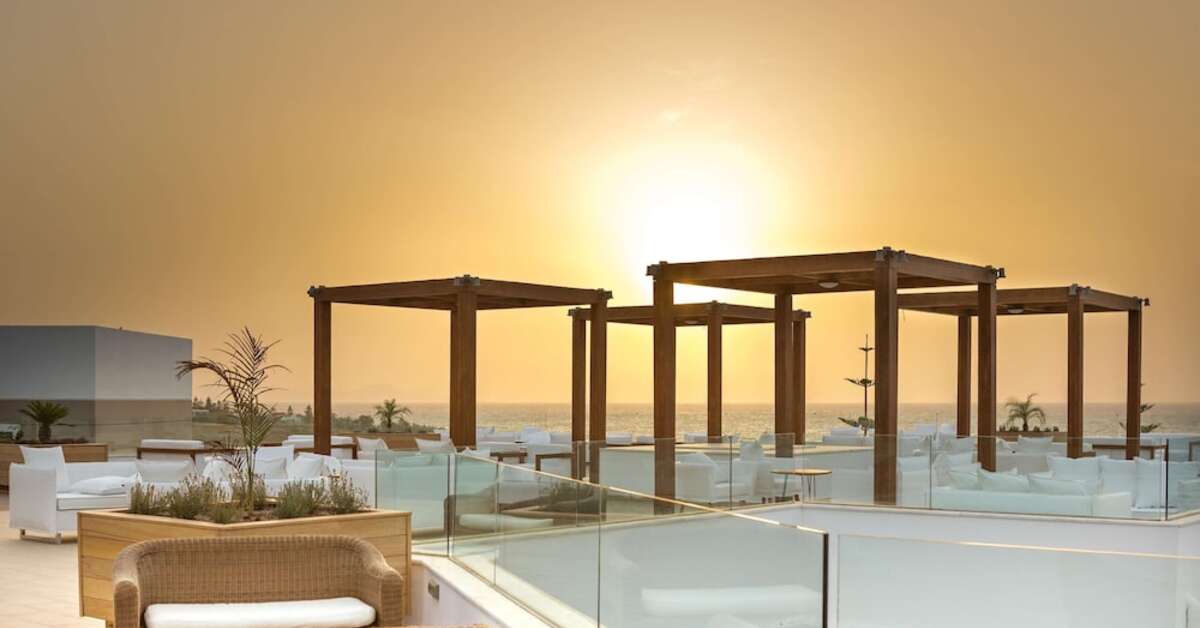 Een foto van het terras bij The Royal Blue Resort & Spa