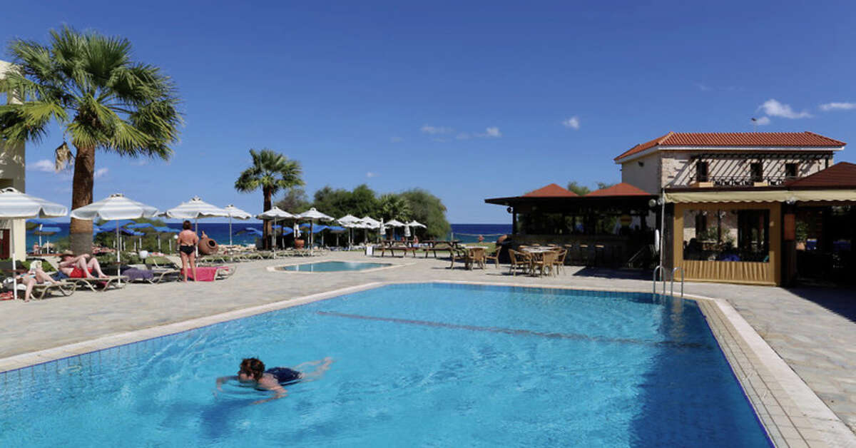 Een foto van het zwembad bij Hotel Mimosa Beach