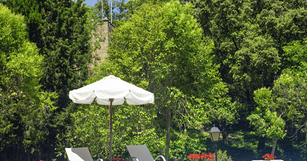 Een foto van het zwembad bij L'Hermitage Hotel & Spa
