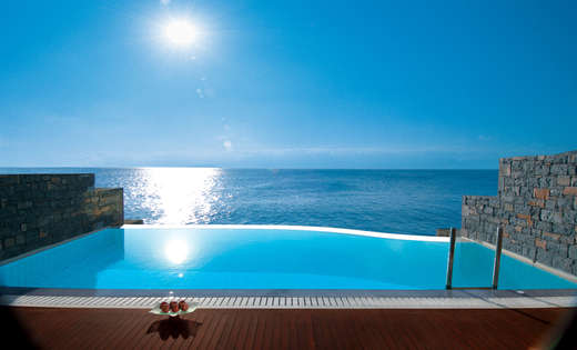 Een foto van het zwembad bij Elounda Beach Hotel & Villas